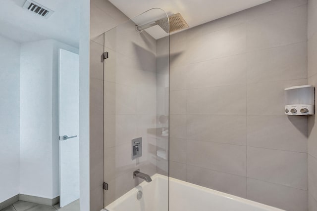 bathroom with visible vents and tub / shower combination