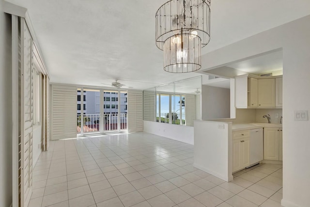 unfurnished living room with light tile patterned floors, a sink, and ceiling fan with notable chandelier