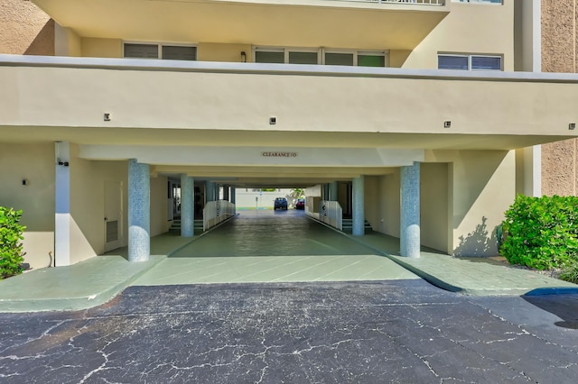 garage featuring a carport and visible vents