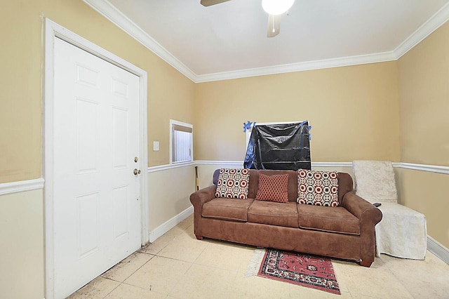 living room with baseboards, crown molding, and a ceiling fan