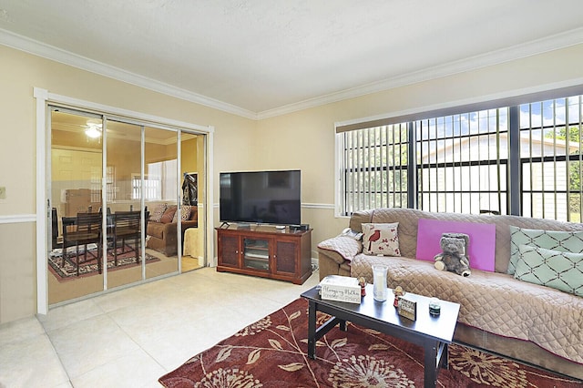 living area featuring ornamental molding and tile patterned flooring