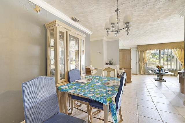 dining space featuring visible vents, a textured ceiling, crown molding, light tile patterned floors, and a chandelier