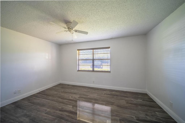 unfurnished room with baseboards, a ceiling fan, dark wood-style flooring, and a textured ceiling