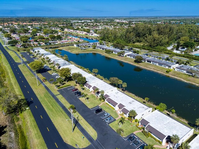 bird's eye view with a residential view and a water view