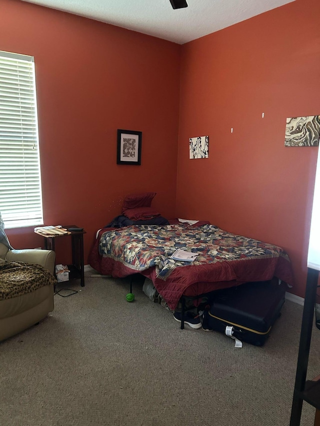 bedroom featuring carpet flooring and ceiling fan