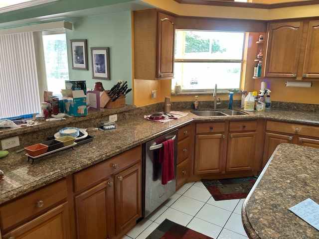 kitchen featuring brown cabinetry and dishwasher