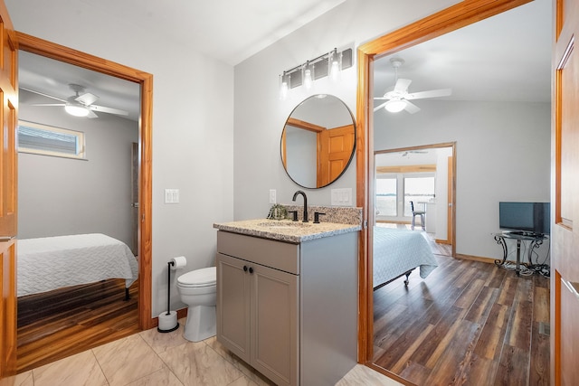 ensuite bathroom featuring ensuite bath, toilet, and a ceiling fan