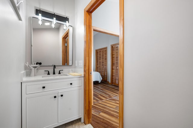 bathroom featuring vanity and wood finished floors