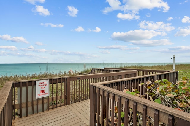 wooden deck featuring a water view