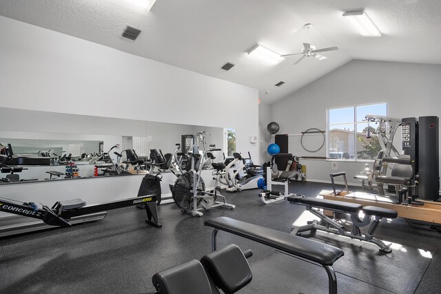 10701 S Ocean Dr Unit 876, Jensen Beach, FL 34957 - gym featuring high vaulted ceiling, baseboards, a ceiling fan, and visible vents