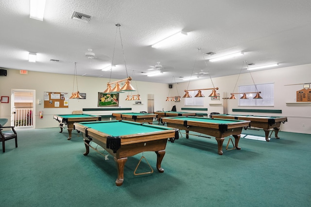 recreation room with a textured ceiling, billiards, and carpet floors