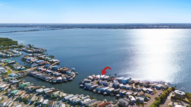 drone / aerial view with a residential view and a water view