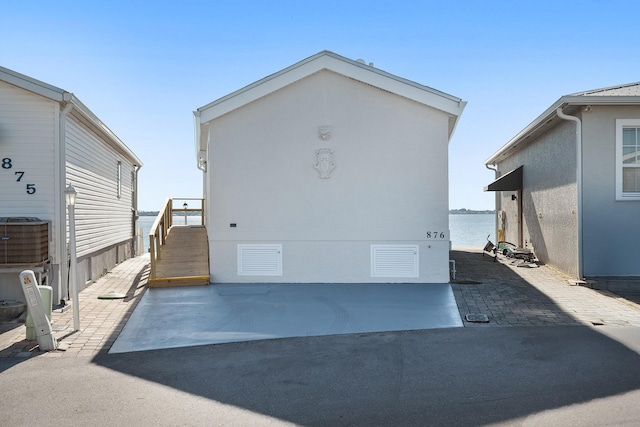 10701 S Ocean Dr Unit 876, Jensen Beach, FL 34957 - rear view of property featuring a patio area and stucco siding