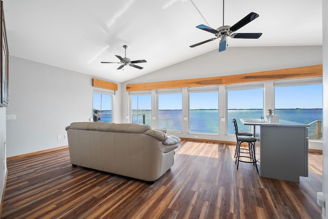 living room with dark wood finished floors, a healthy amount of sunlight, and a ceiling fan