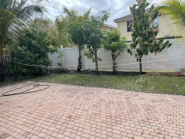 view of patio / terrace featuring fence