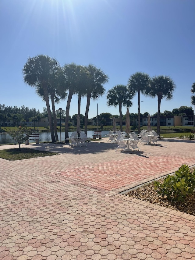 view of community with a water view