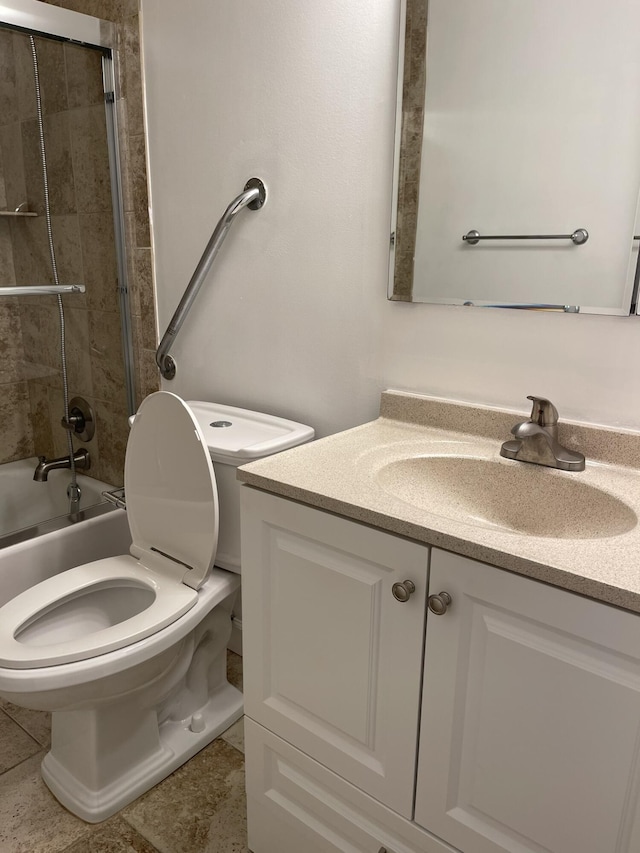 bathroom with vanity, toilet, tub / shower combination, and tile patterned flooring