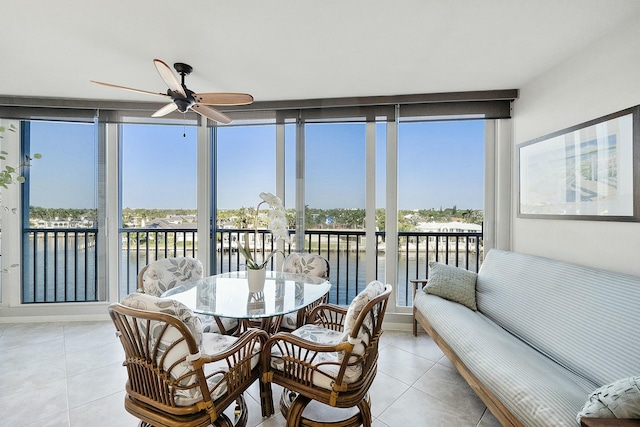 sunroom featuring a wealth of natural light and ceiling fan