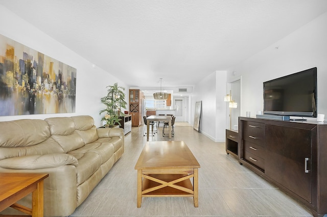 living room with visible vents and baseboards