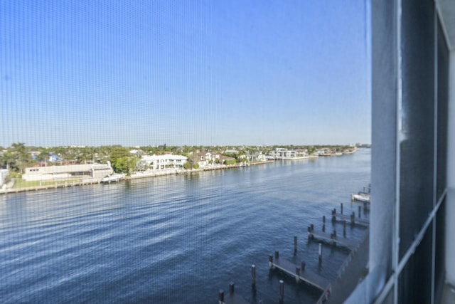 property view of water with a dock