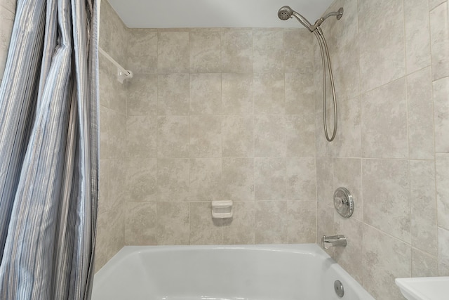 bathroom featuring shower / tub combo with curtain