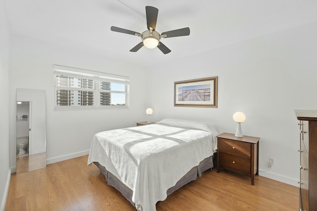 bedroom featuring ceiling fan, baseboards, and light wood-style floors