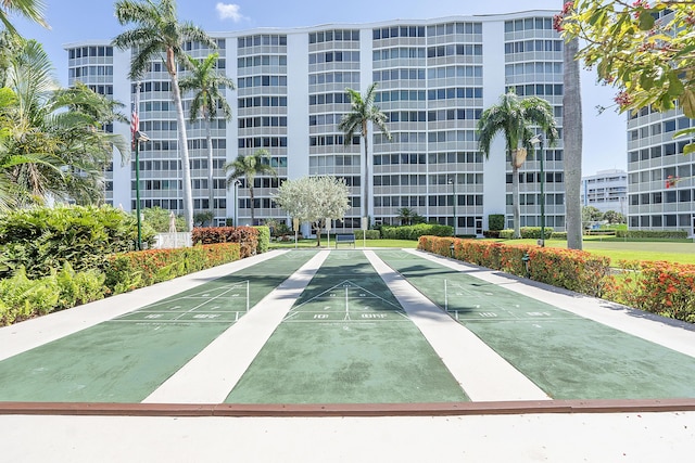 view of home's community featuring shuffleboard