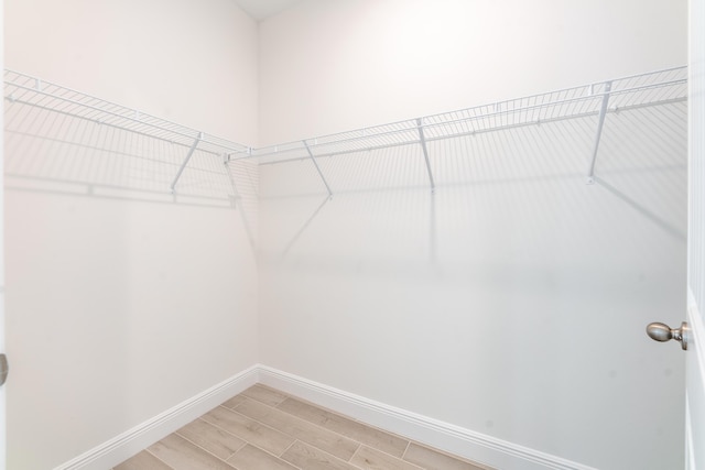 walk in closet featuring light wood-type flooring