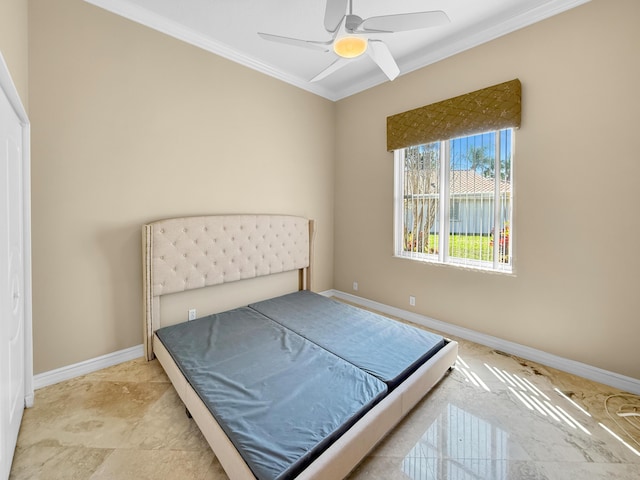 bedroom featuring baseboards, ceiling fan, and crown molding