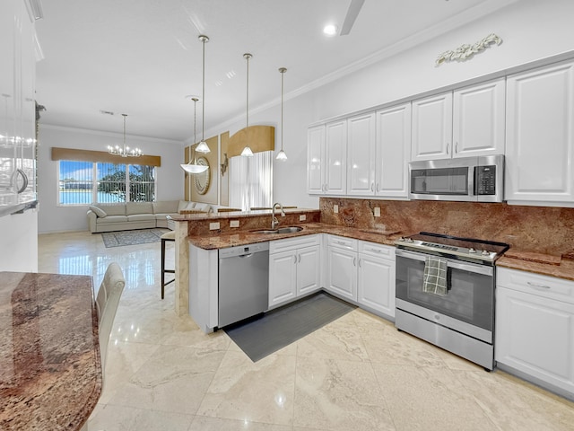 kitchen featuring a sink, stainless steel appliances, marble finish floor, and white cabinetry