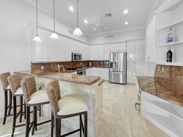 kitchen featuring a ceiling fan, visible vents, dark stone counters, appliances with stainless steel finishes, and marble finish floor