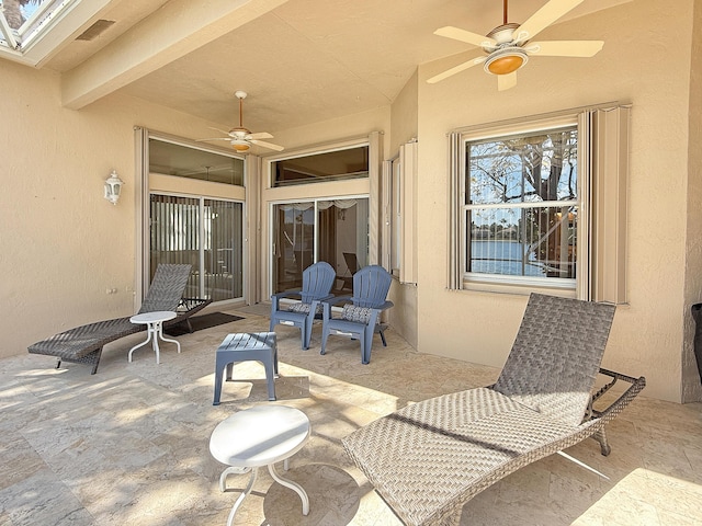 view of patio with visible vents and ceiling fan