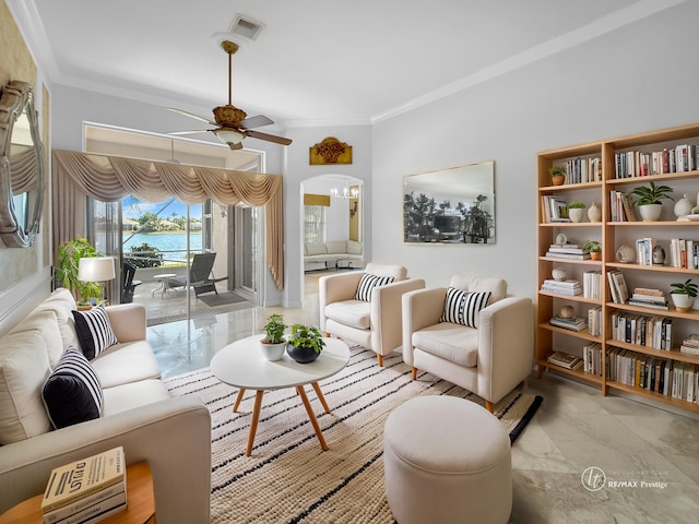 living area featuring visible vents, a water view, ornamental molding, marble finish floor, and a ceiling fan