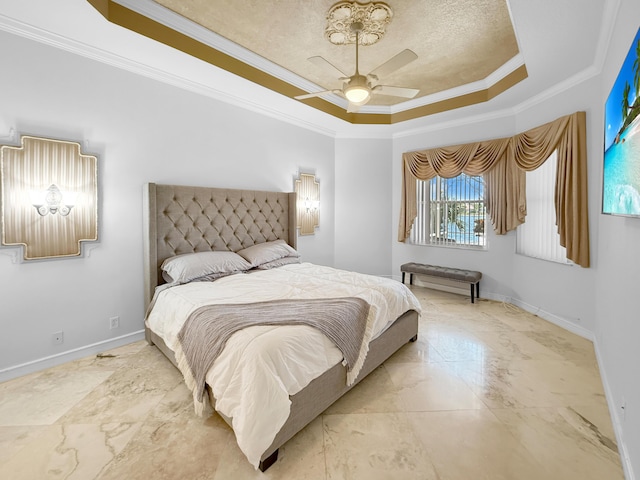 bedroom with a tray ceiling, baseboards, marble finish floor, and crown molding