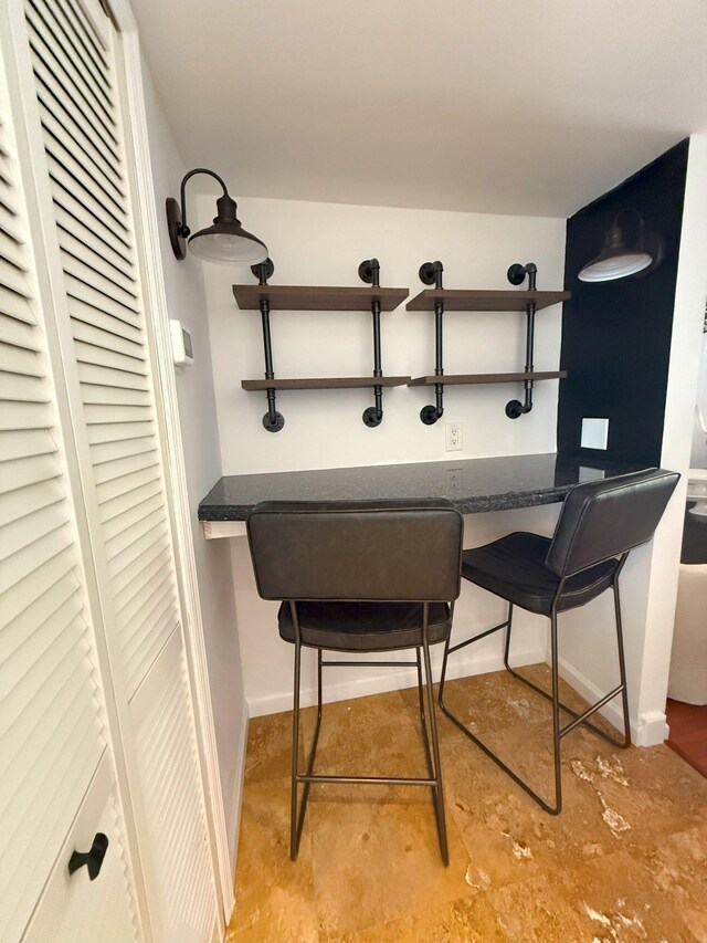 dining area featuring baseboards