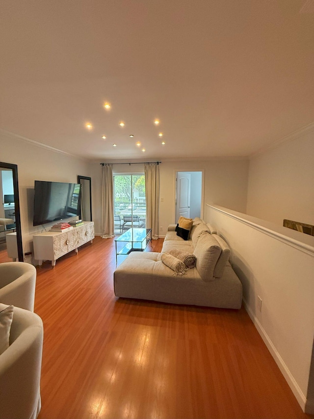 unfurnished living room featuring recessed lighting, baseboards, and wood finished floors