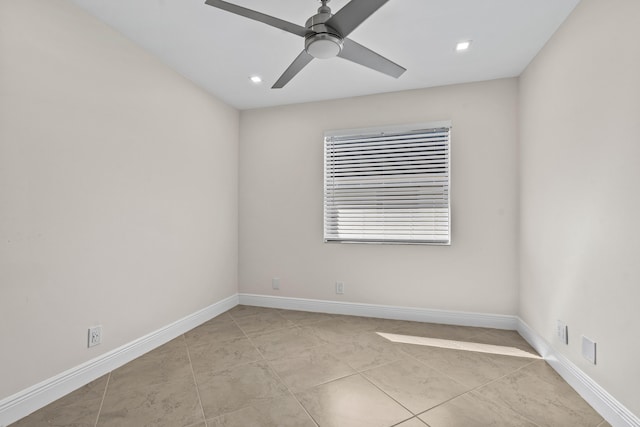 unfurnished room with baseboards and a ceiling fan