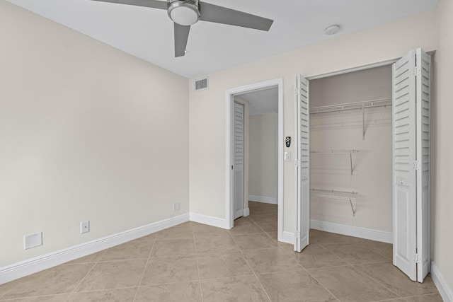 unfurnished bedroom featuring a closet, visible vents, ceiling fan, and baseboards