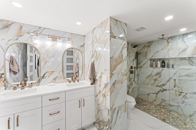 bathroom featuring visible vents, a sink, a marble finish shower, double vanity, and stone wall