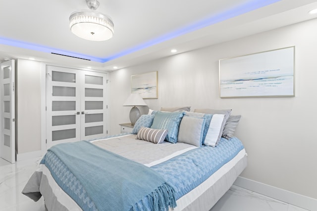 bedroom featuring recessed lighting, baseboards, and marble finish floor