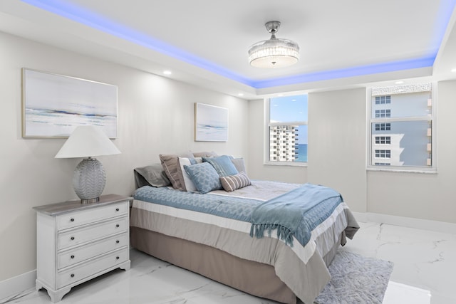 1150 Hillsboro Mile Unit 714, Hillsboro Beach, FL 33062 - bedroom featuring a tray ceiling, baseboards, marble finish floor, and recessed lighting