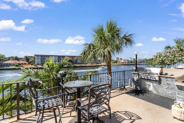 1150 Hillsboro Mile Unit 714, Hillsboro Beach, FL 33062 - view of patio / terrace featuring a water view, a balcony, and exterior kitchen