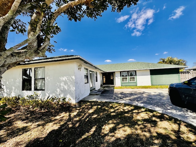 view of front facade featuring a patio and stucco siding