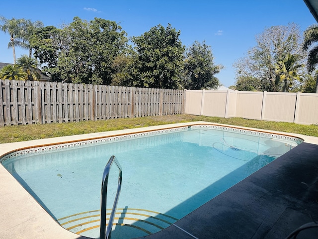 view of swimming pool featuring a fenced backyard and a fenced in pool