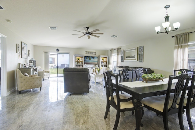 dining room with visible vents and ceiling fan with notable chandelier