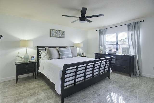 bedroom featuring ceiling fan and baseboards