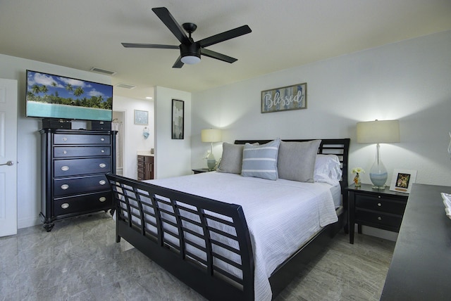 bedroom featuring visible vents, connected bathroom, and a ceiling fan