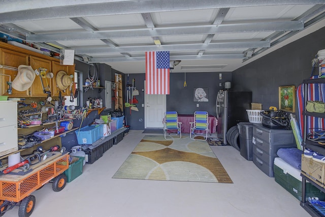 garage with freestanding refrigerator