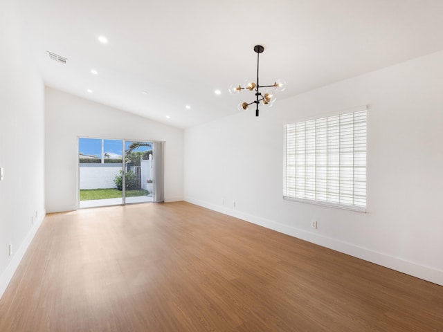 4524 Concordia Ln, Boynton Beach, FL 33436 - spare room with lofted ceiling, light wood finished floors, a chandelier, and recessed lighting