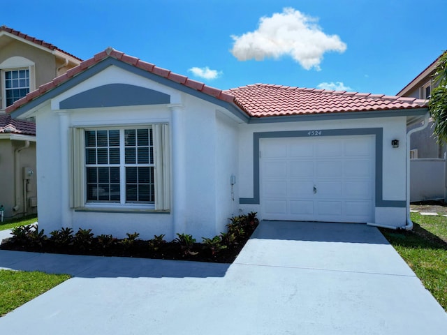 4524 Concordia Ln, Boynton Beach, FL 33436 - view of front of home featuring an attached garage, stucco siding, and a tiled roof